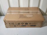a box that is sitting on a table next to a wall