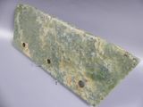 an image of a piece of green marble sitting on top of a table