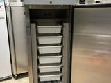 an image of a refrigerator with a bunch of containers inside of it