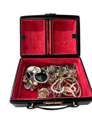 a black case with a bunch of jewelry inside of it