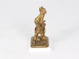 an antique bronze figurine of a man and a dog on a marble base