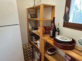 a white refrigerator in the corner of a kitchen