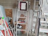 a ladder that is leaning against a wall in a garage