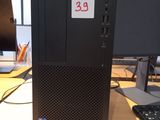 a desktop computer sitting on a desk in front of a computer monitor