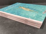 two books sitting on top of each other on a table