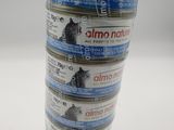 a stack of cans of canned cat food on a table