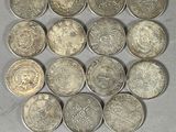 some coins are arranged in a square on a table