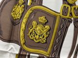 a brown and gold horse with a crown on it ' s back