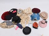 a pile of clothes and hats on a white surface