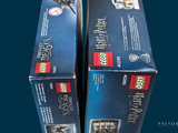two boxes of lego harry potter books on a table