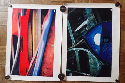 two pictures hanging on the wall of a room