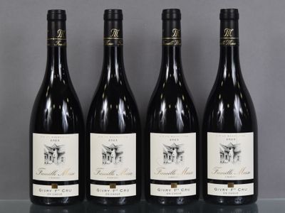 three bottles of wine are lined up on a table