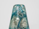 an image of a blue glass vase sitting on top of a white surface