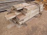 several pieces of wood stacked on top of each other in a pile