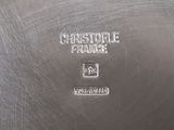 an antique silver plate with the name of a restaurant on it