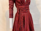 a red and black checkered dress on a mannequin mannequin mannequin mannequin mannequin mannequin mannequin manne