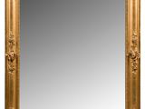 un miroir encadré d'or sur fond blanc
