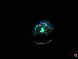 a close up of a glowing orb in the dark with a black background