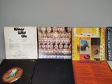 three vinyl records are sitting on a table next to each other