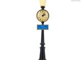 a clock that is on top of a lamp post