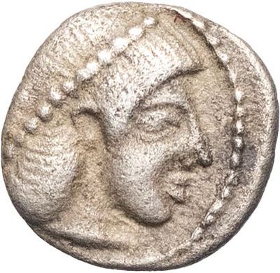 a silver coin with a woman ' s face on it