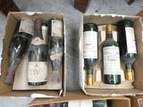 two boxes of wine that are sitting on the floor