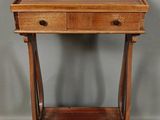 an old wooden table with a drawer on top of it