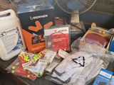 many items that are sitting on a table in front of a fan