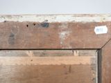 a close up of a piece of wood with a sticker on it