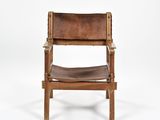 a brown leather chair on a white background