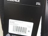 the back of a black backpack with a label on it