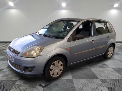 a picture of a silver car parked in a garage