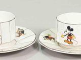 pair of mickey mouse coffee cups and saucers