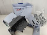 a pile of paper and a printer sitting on a table