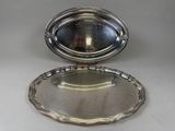 a silver plate with a mirror in the middle of it