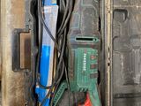 a tool in a case with a cord and a hammer