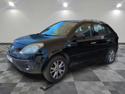 a picture of a black car parked in a garage