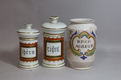 three jars that are sitting next to each other on a table