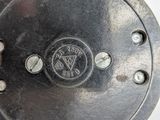 a close up of a metal plate with a logo on it