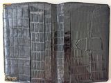 crocodile skin leather wallet with a gold clasp and a black card holder