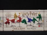 a box of harry potter action figures that are on display