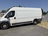 a white van that is parked on the side of the road