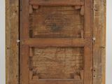 an old wooden picture frame with a picture of a man on it