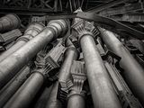 black and white photograph of a bunch of pipes in a building