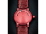 an image of a close up of a red watch on a black surface