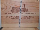 a wooden box that has some wine in it