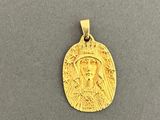 a gold coin with a face of jesus on it