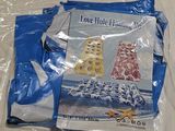 un sac en plastique sur lequel est représentée une scène de plage