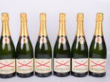 six bottles of champagne are lined up in a row