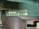 a close up of a green machine with a label on it
